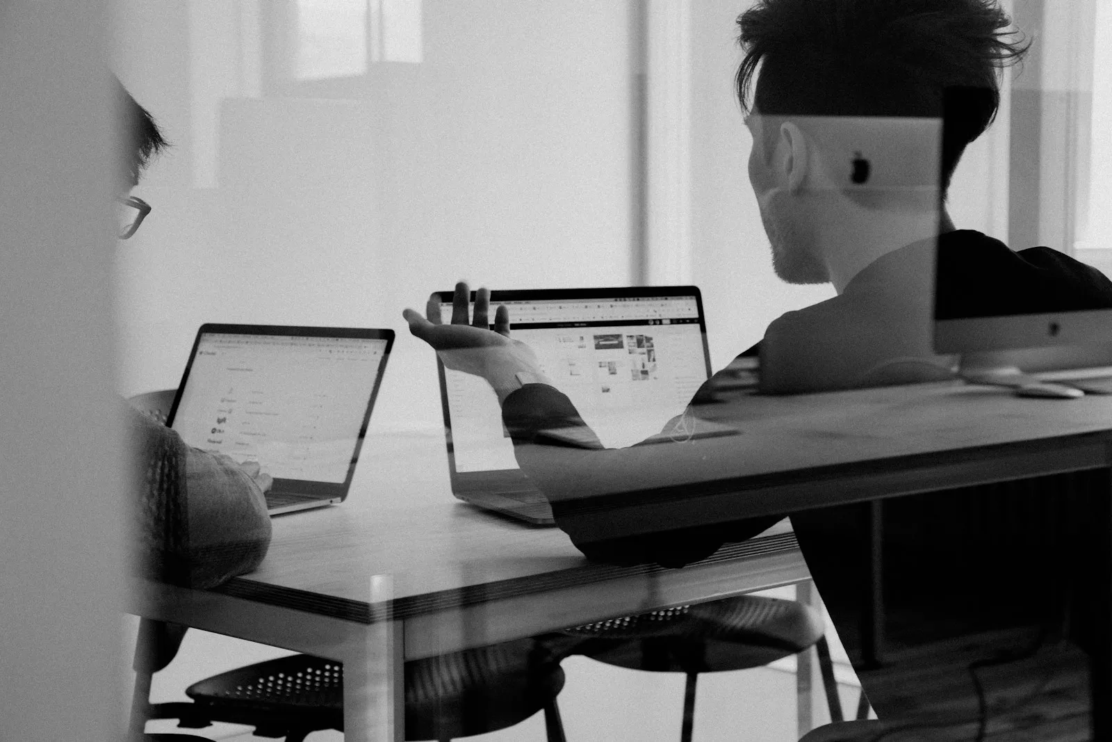 Professional working at a laptop in a bright office