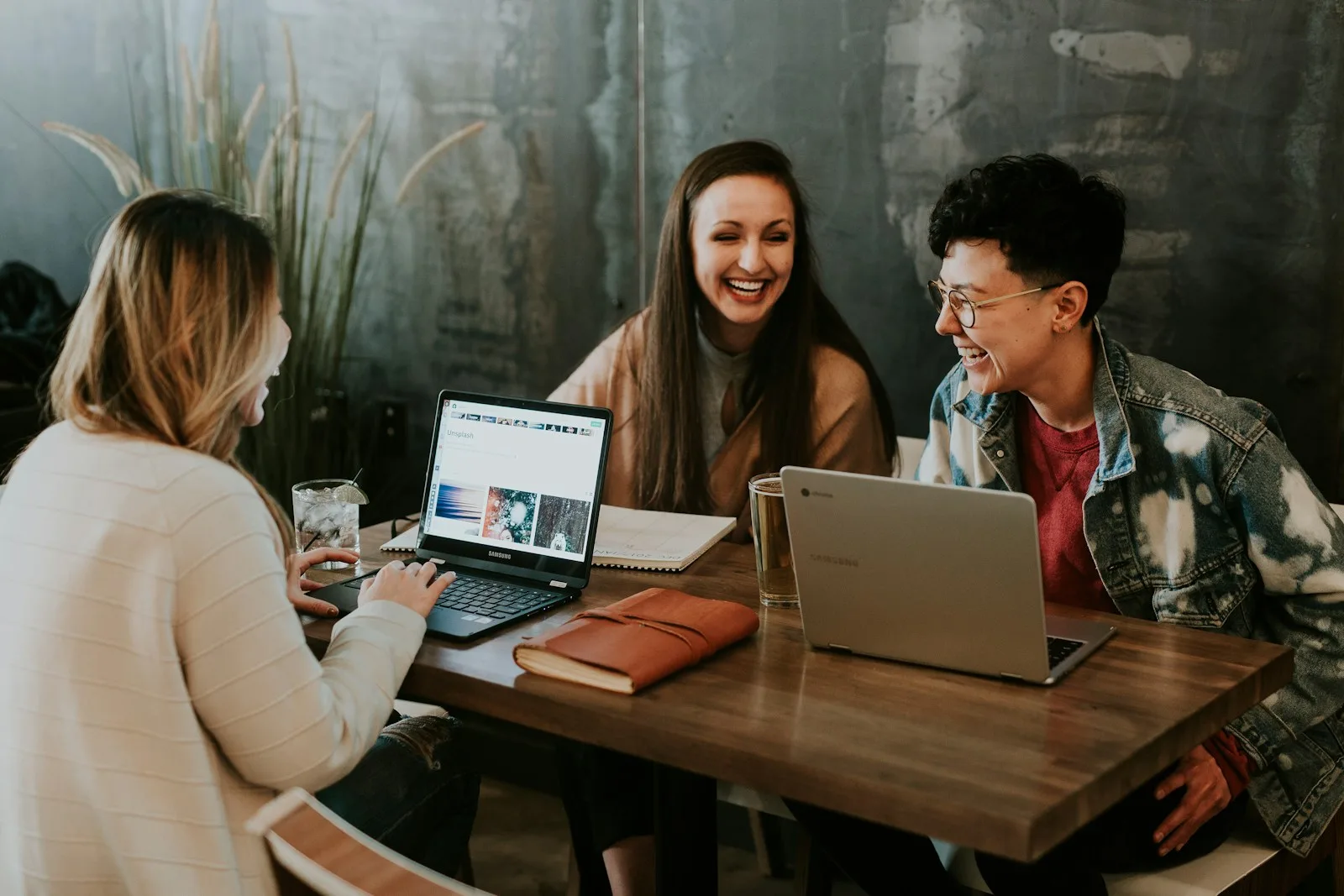 Team members collaborating around a shared workspace