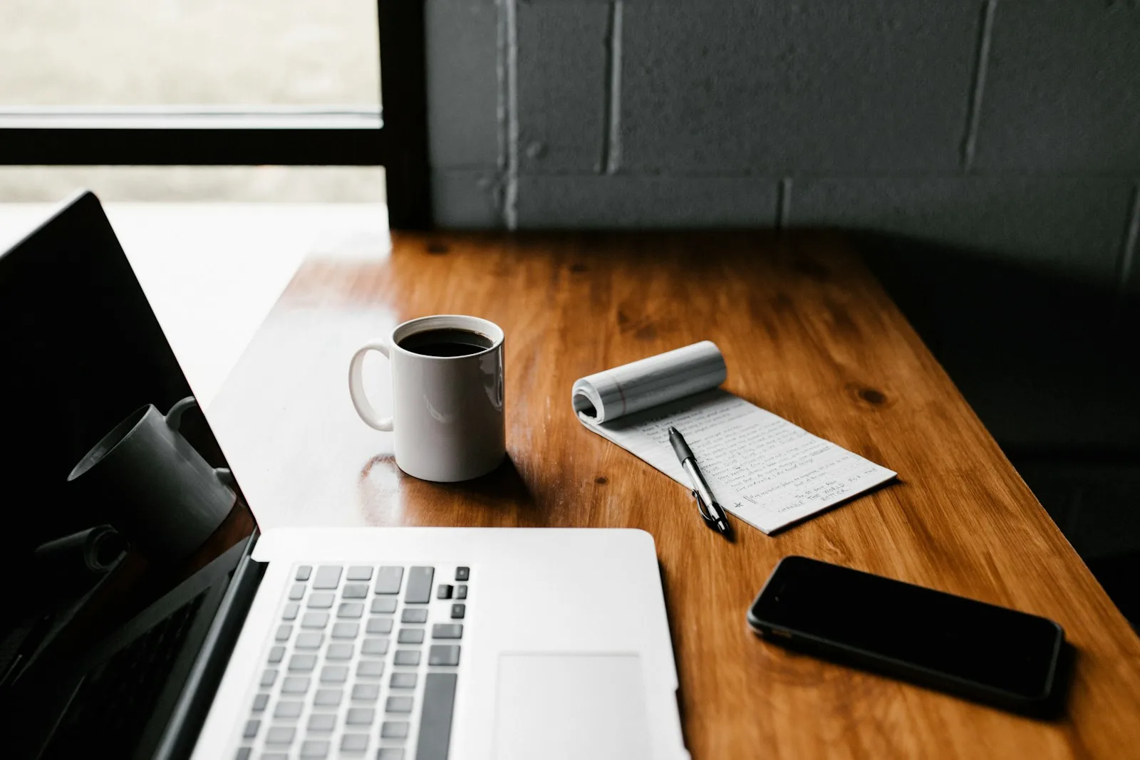 Person working thoughtfully at a desk