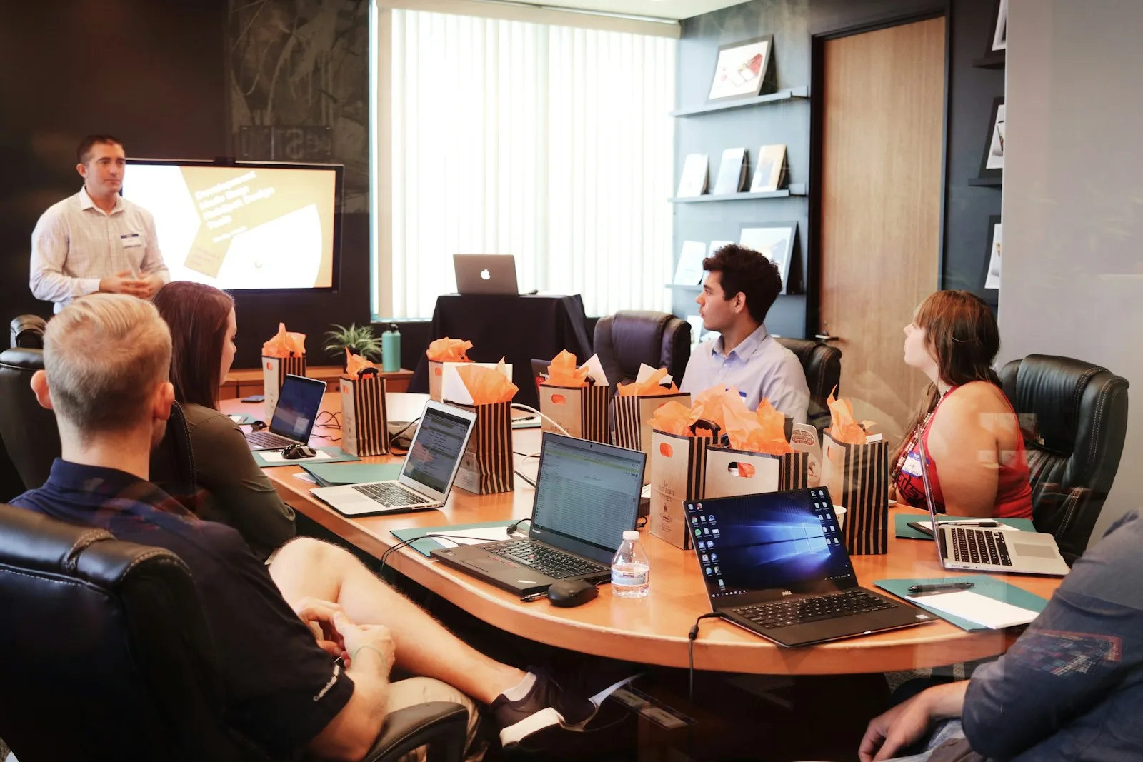Collaborators discussing a project around a table